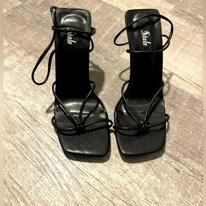 Black strappy heels never worn. Size 5
